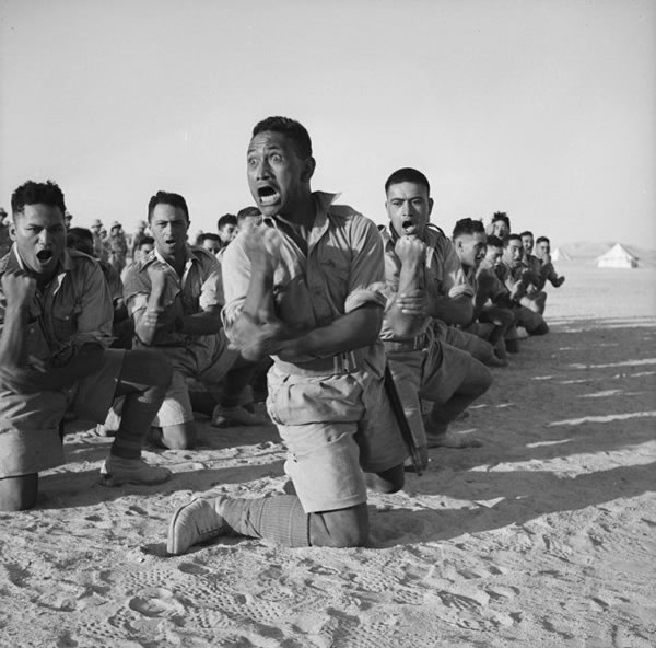 Members of the Māori Battalion's C Company perform a haka for the King of Greece at Helwan, Egypt, on 25 June 1941