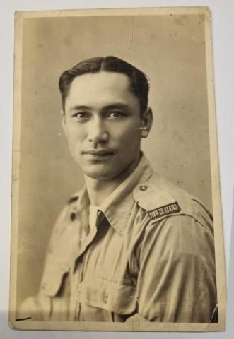 black and white portrait of a man in a New Zealand army uniform. 